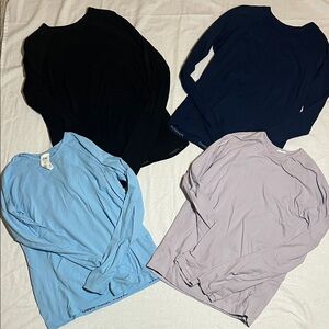 Set of four Athleta girl long sleeve tops (lavender, black, navy, and blue)